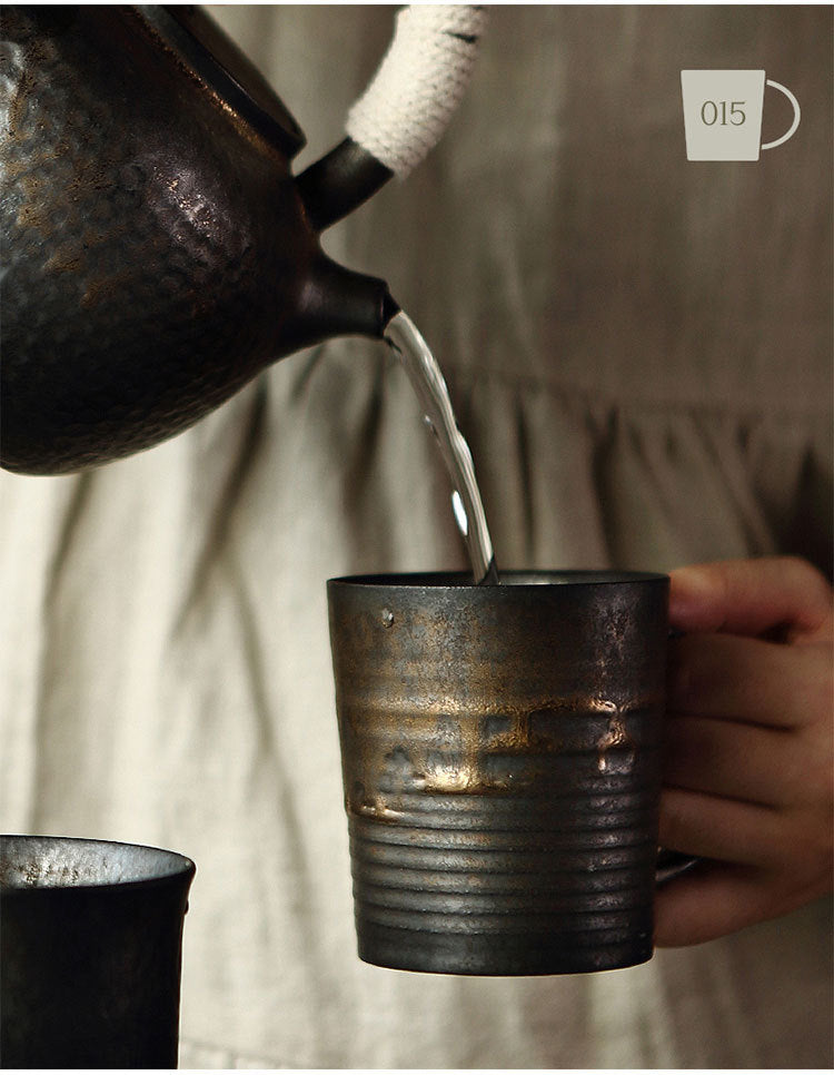 Gilt glazed ceramic tea cup